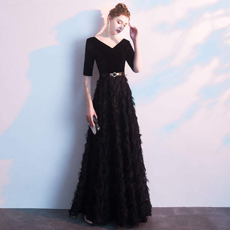 Elegant black evening dress for women with V-neck, five-point sleeves, fitted waist, and textured long skirt