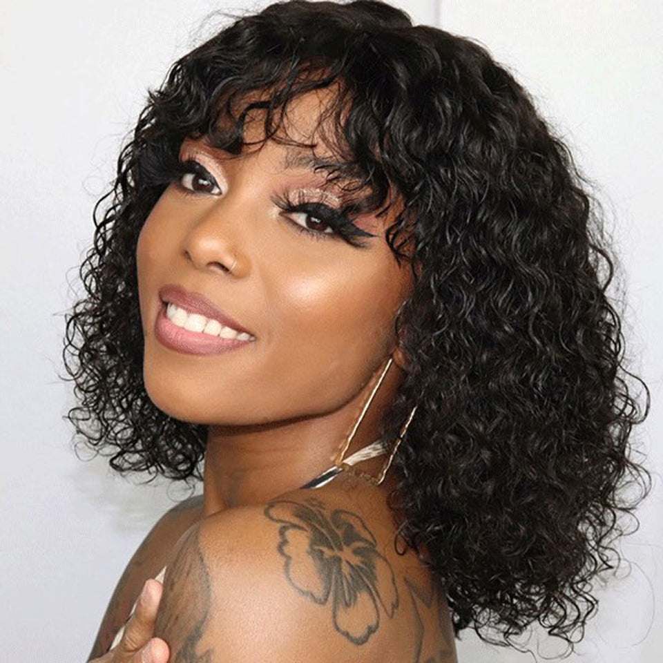 woman wearing a short curly black full machine made water wave bob wig smiling