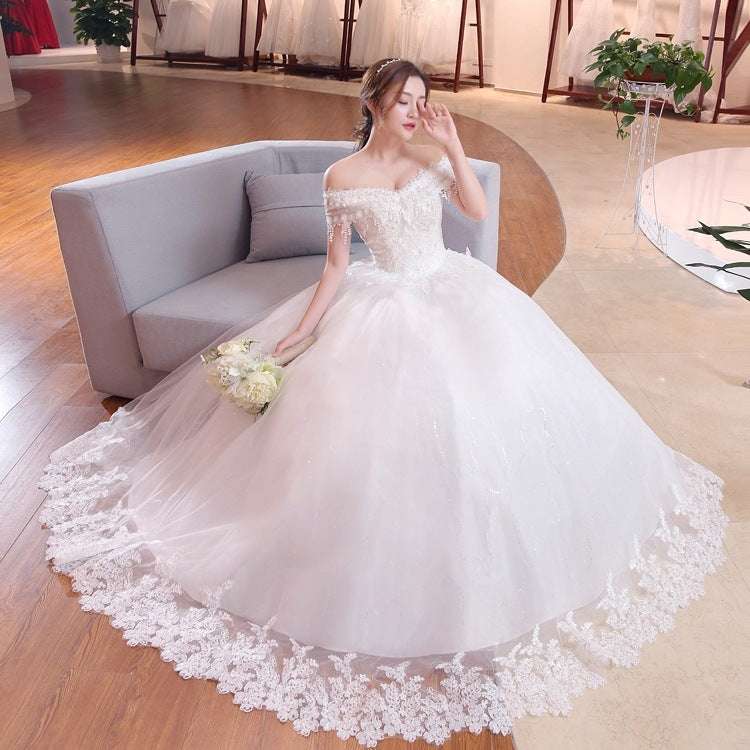 Plus size white shoulder-to-shoulder lace wedding dress with puff skirt and floral hem lace trim