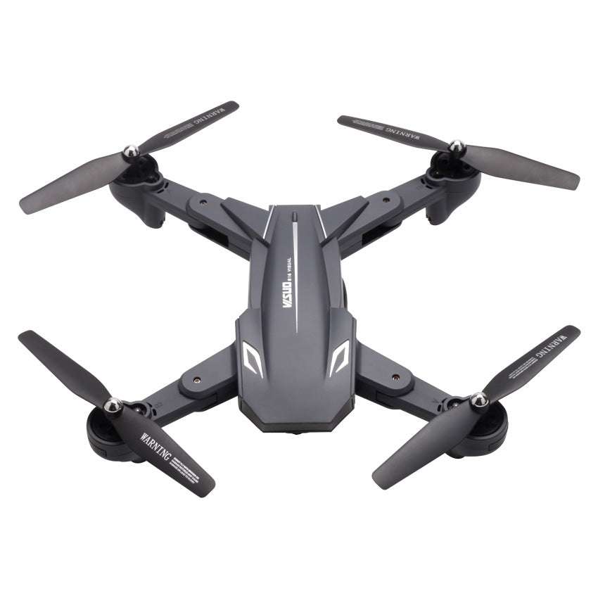 Compact professional aerial photography folding quadcopter drone with 4K camera and four propellers in grey color
