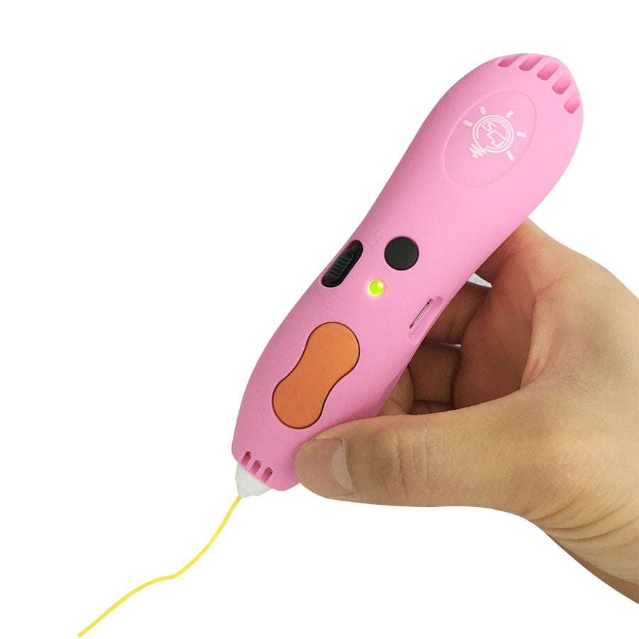 Hand holding pink charging low temperature 3D printing pen with yellow filament strand