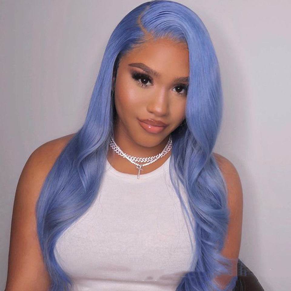 Woman wearing long blue body wave human hair lace front wig with side part and white sleeveless top