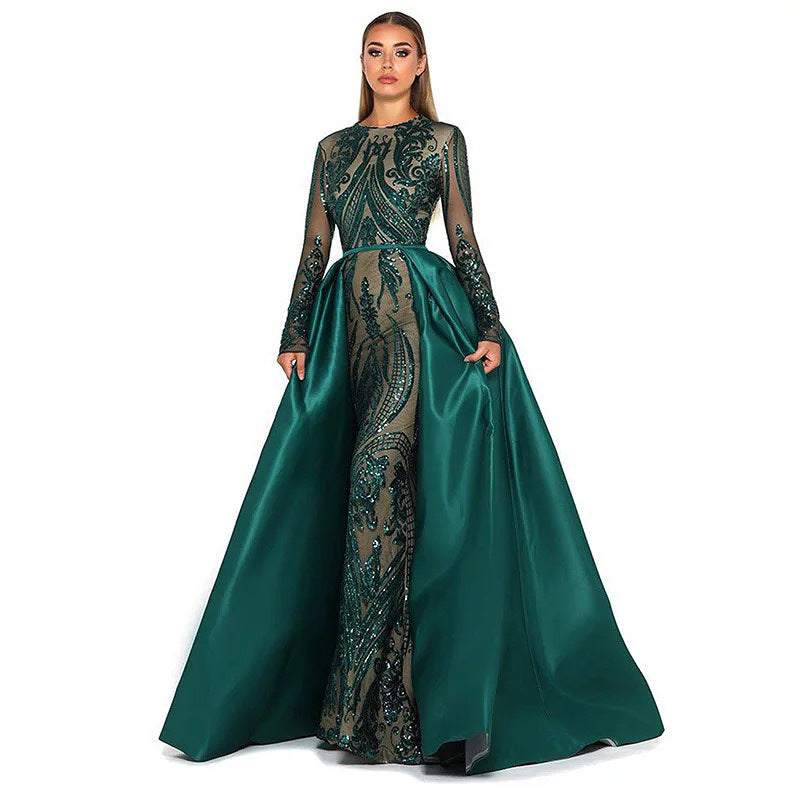 Slim high-end evening dress with long sleeves, intricate patterns, and a fishtail skirt in dark green satin and lace.