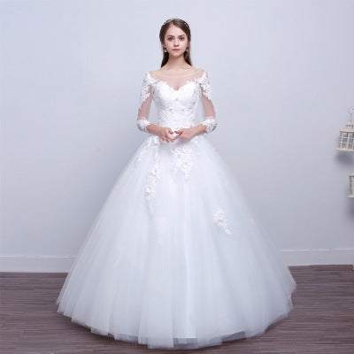 New shoulders Slim Qi lace wedding dress with long sleeves and full tulle skirt