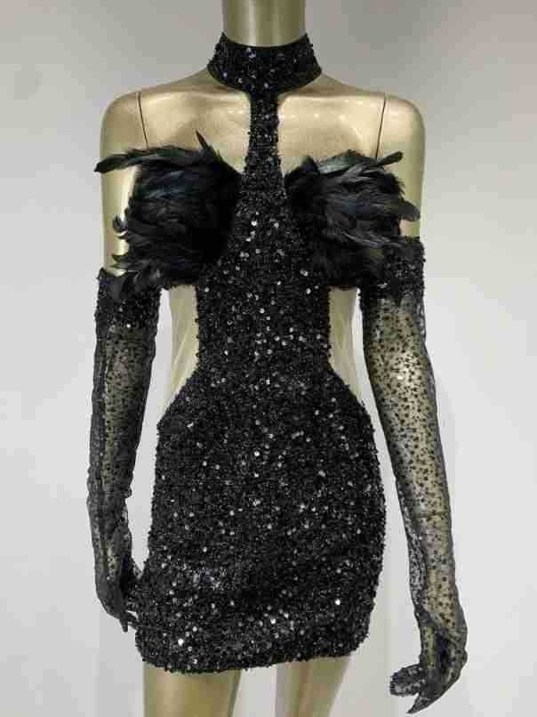 Black halter feather dress with sequins and long sheer gloves, sleeveless and high waist short skirt design.