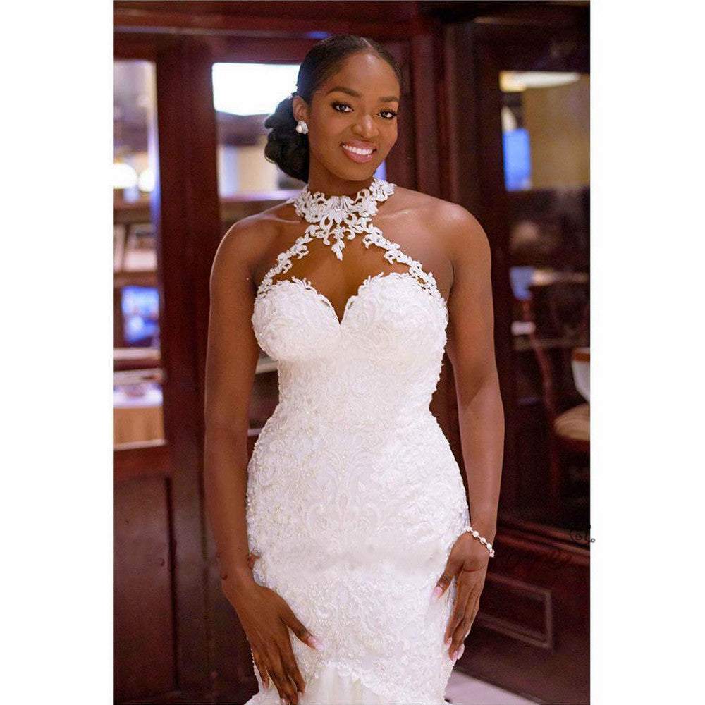 Elegant vintage lace beaded sleeveless halter neck mermaid wedding dress with tulle fabric and sweep train