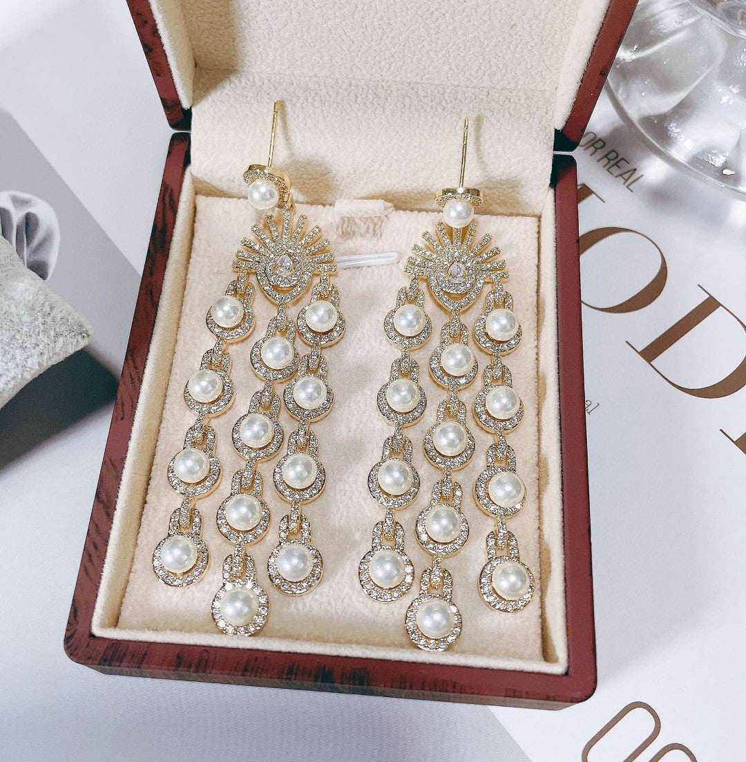 Gold Micro Inlay Zircon style beaded fringe earrings with pearl accents in a jewelry box