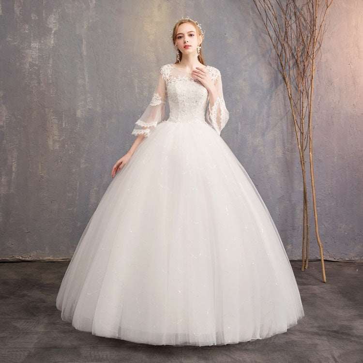 White bridal ball gown wedding dress with lace sleeves and full tulle skirt