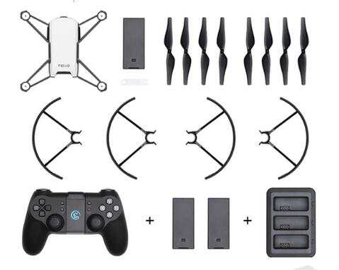 Smart toy airplane with remote control, propellers, battery packs, and charging dock laid out on white background