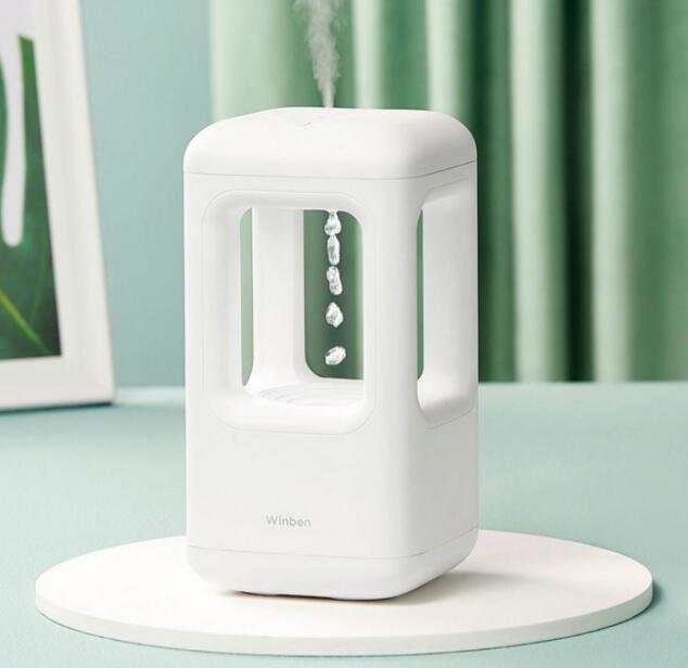 White compact anti-gravity water drop humidifier with cool mist and quiet operation for bedroom use