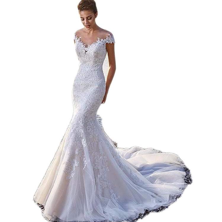 Princess bride mermaid wedding dress with lace detailing, trailing skirt, and off-shoulder neckline