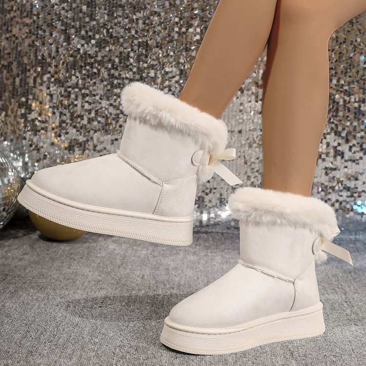 Winter Snow Boots With Bowknot Fashion Round Toe Flat Thickened Suede Overview:Unique design, stylish and beautiful.Good material, comfortable feet.A variety of colors, any choice.Specification:Function: Anti slip, Warm, Wear resistantDropshipmanAMIR BAGS INDIA PRIVATE LIMITEDnull