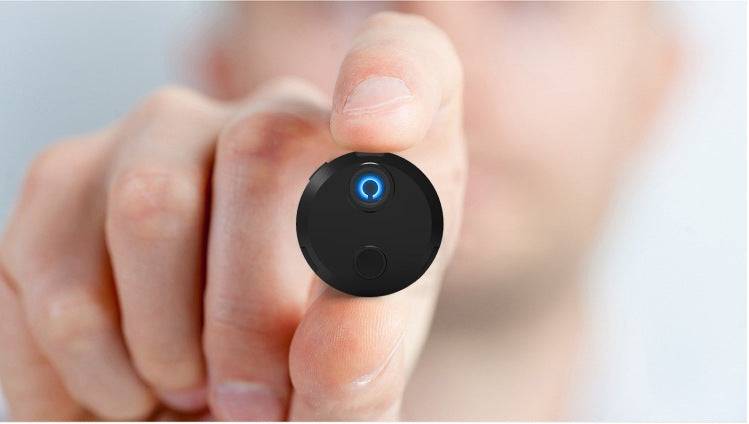 HDQ15 home surveillance camera held between fingers with 1920x1080 resolution