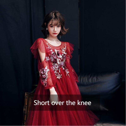Red medium wine evening gown with floral embroidery and sheer flutter sleeves, short over the knee length, made from polyester blend fabric.