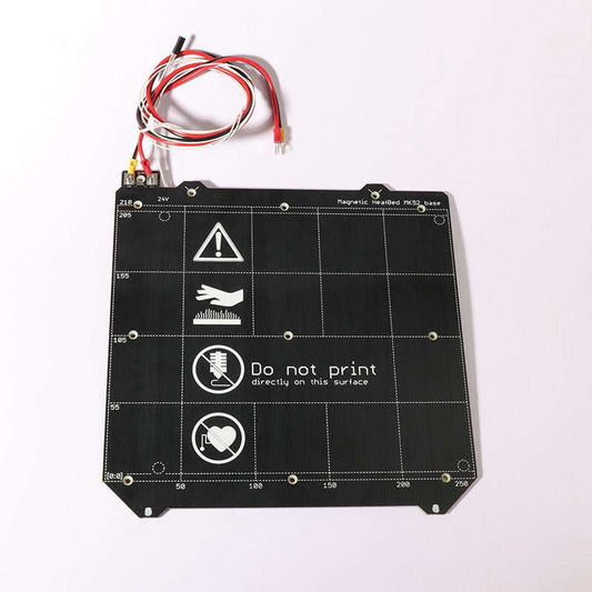Black magnetic heated bed 3D printer accessory with warning icons and connected wires.
