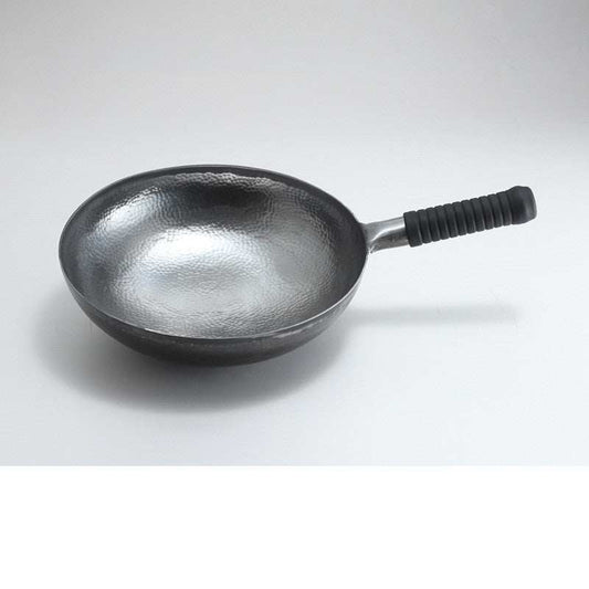 Household one-piece non-stick iron pan with black handle and hammered surface