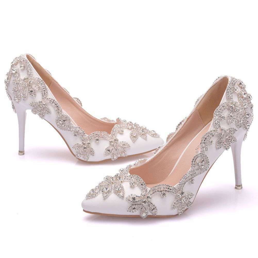 White rhinestone high heel shoes for women with stiletto heels and intricate crystal embellishments.