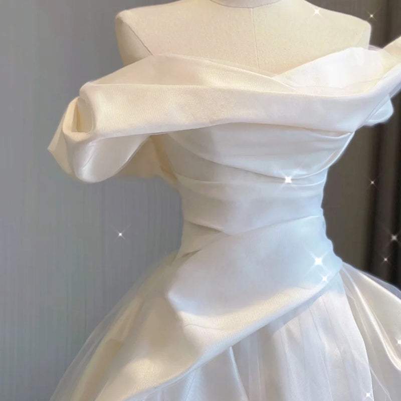 White temperament princess style French satin tail dress with off-shoulder neckline and soft satin fabric